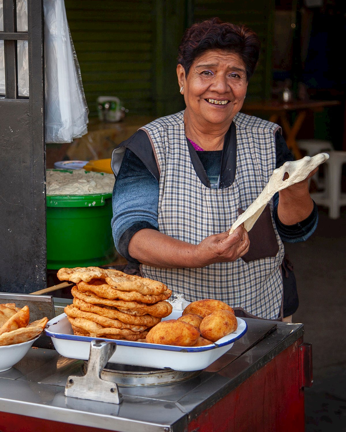 Open air street vendor selling scones and fried bread - 