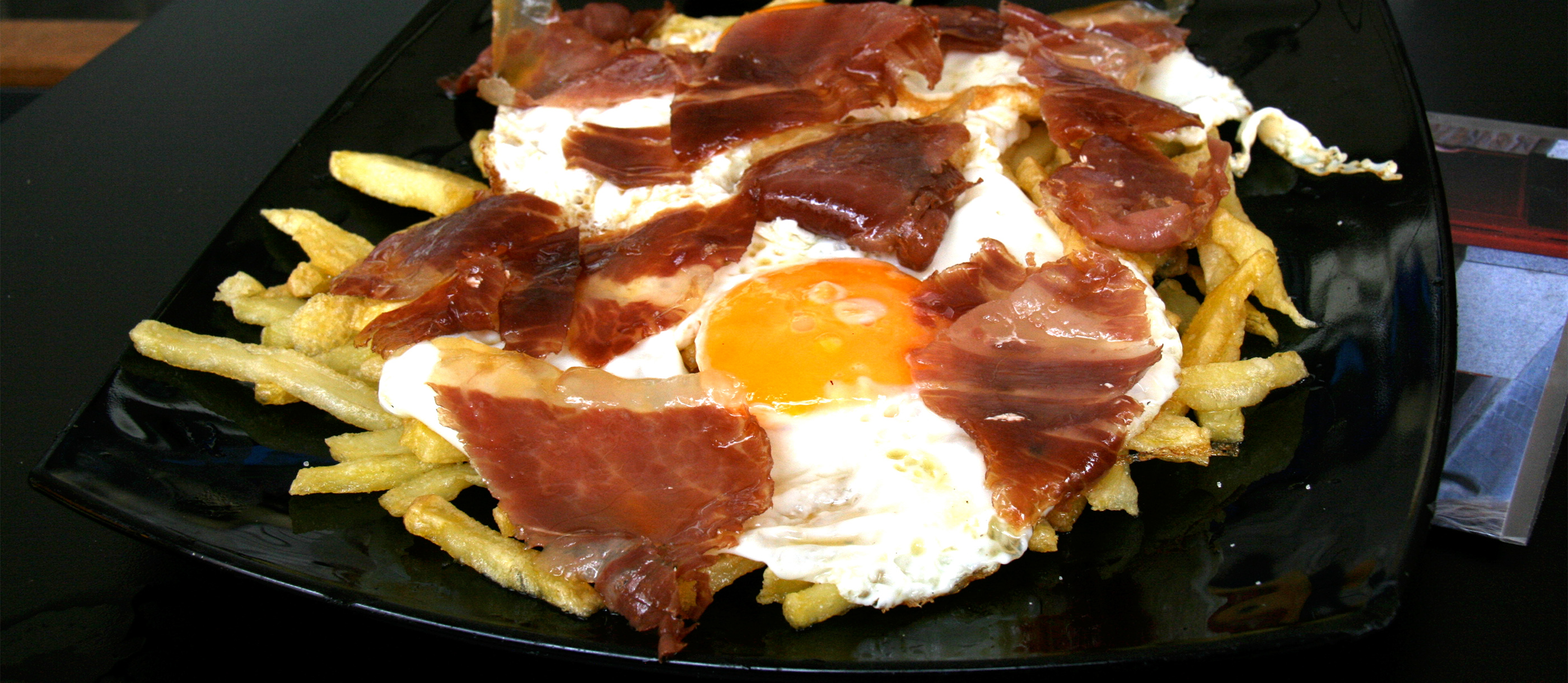 huevos-rotos-traditional-egg-based-dish-from-madrid-spain-tasteatlas