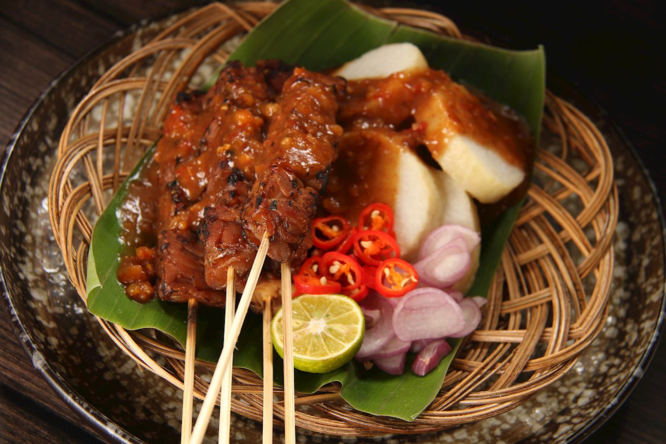 Indonesian dish with skewers crossword